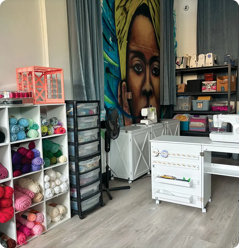 Craft room with yarn and sewing machines.