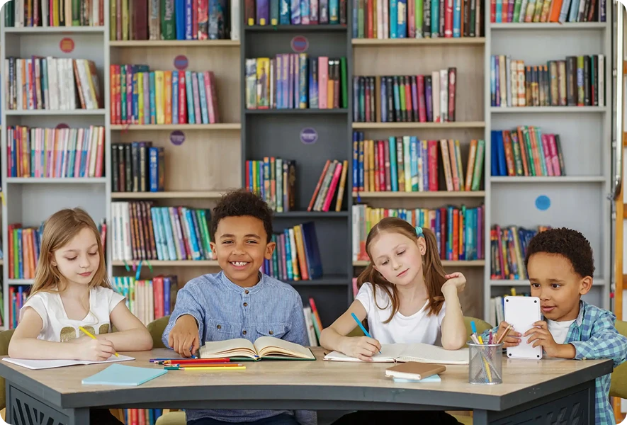 Children studying together in a library.